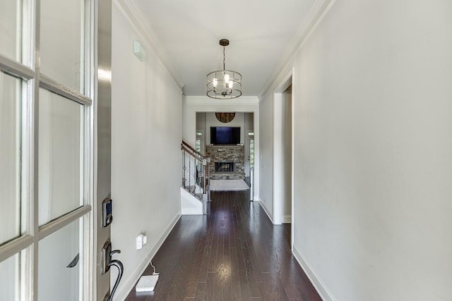 6206 Little Cove Dr, Flowery Branch, GA 30542 - hall featuring a chandelier, ornamental molding, dark wood-style floors, and stairway