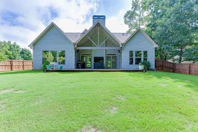 6206 Little Cove Dr, Flowery Branch, GA 30542 - back of property with a fenced backyard and a chimney