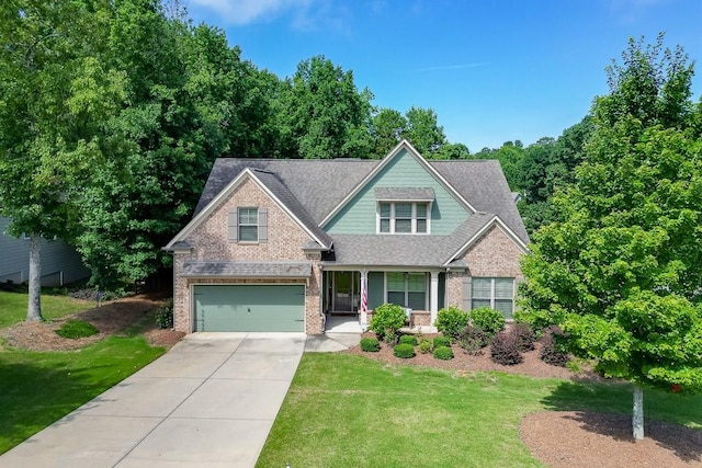 6206 Little Cove Dr, Flowery Branch, GA 30542 - craftsman-style house featuring concrete driveway, an attached garage, brick siding, and a front lawn