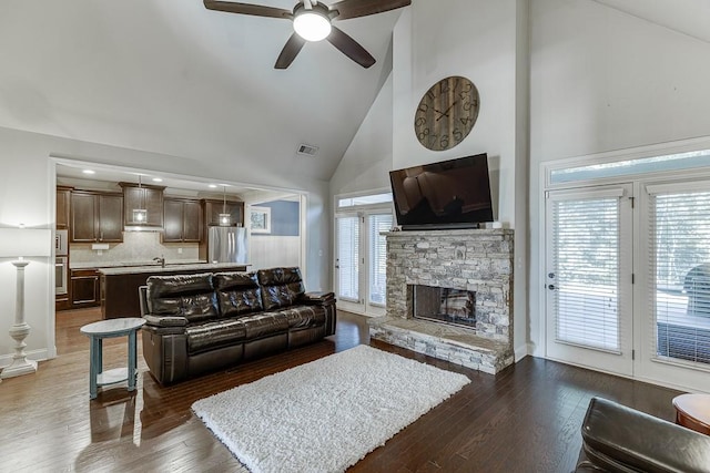 6206 Little Cove Dr, Flowery Branch, GA 30542 - living area featuring high vaulted ceiling, a ceiling fan, dark wood-style flooring, and a fireplace