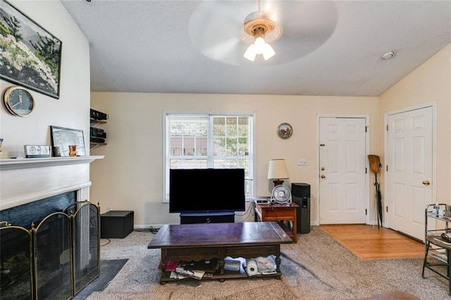 80 Jacob Trl, Rockmart, GA 30153 - carpeted living area featuring ceiling fan and a fireplace with flush hearth