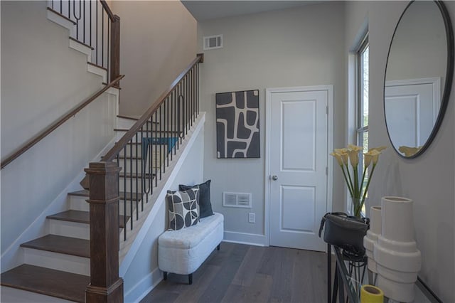 stairs featuring wood-type flooring