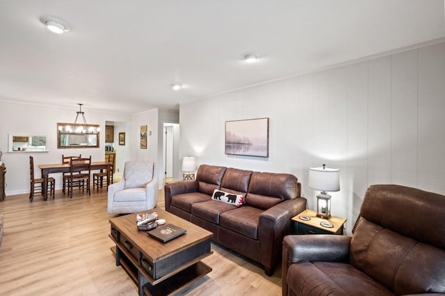 living area with a chandelier and light wood finished floors