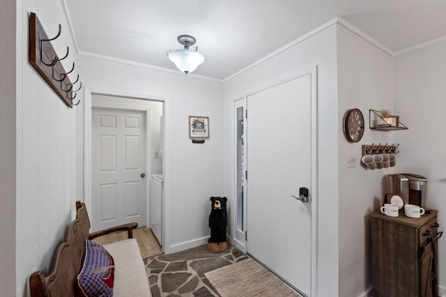 entrance foyer featuring baseboards and crown molding