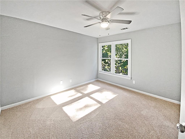 empty room with carpet floors and ceiling fan