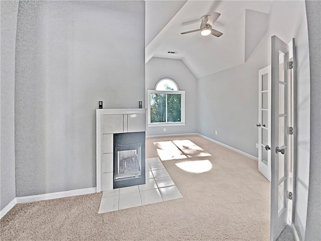 unfurnished living room featuring light carpet, ceiling fan, and vaulted ceiling