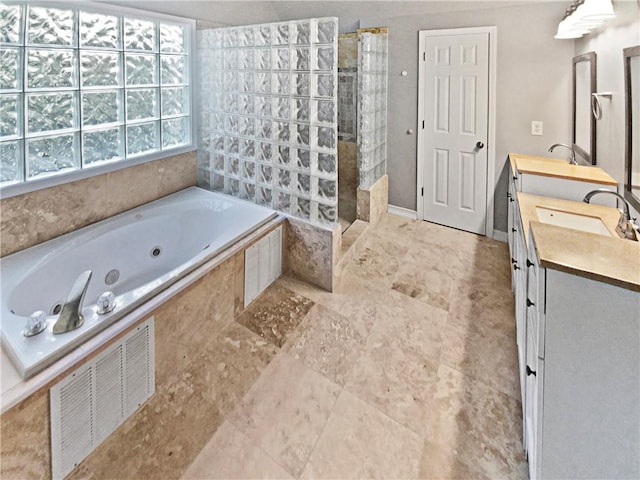 bathroom featuring vanity and shower with separate bathtub