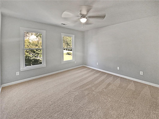 carpeted empty room with ceiling fan