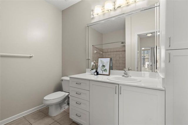 full bathroom featuring baseboards, a shower, toilet, tile patterned floors, and vanity