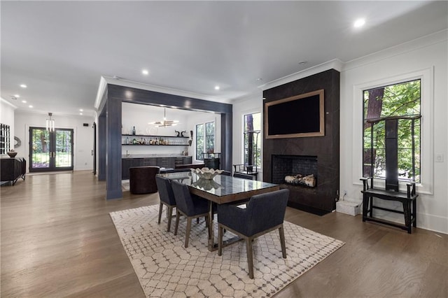306 Pinecrest Rd NE, Atlanta, GA 30342 - dining space featuring a high end fireplace, crown molding, wood finished floors, recessed lighting, and a chandelier