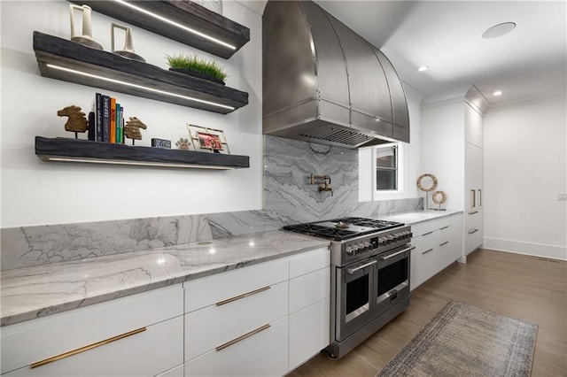 306 Pinecrest Rd NE, Atlanta, GA 30342 - kitchen with range with two ovens, open shelves, backsplash, island range hood, and wood finished floors