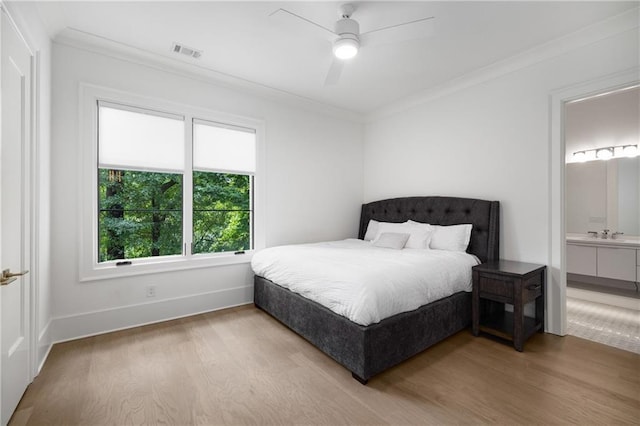 306 Pinecrest Rd NE, Atlanta, GA 30342 - bedroom with wood finished floors, crown molding, baseboards, ensuite bath, and a ceiling fan