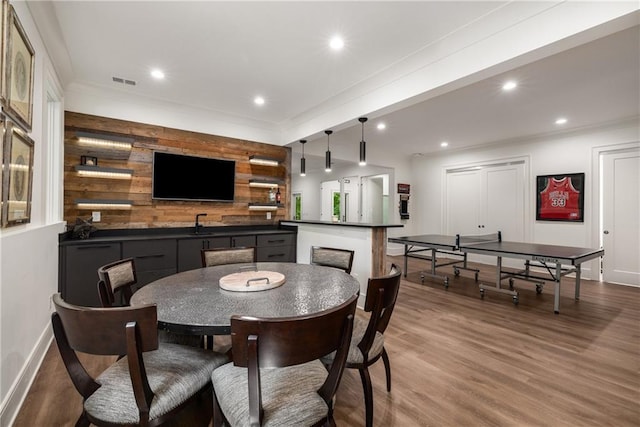 306 Pinecrest Rd NE, Atlanta, GA 30342 - dining area featuring wood finished floors, baseboards, recessed lighting, ornamental molding, and wood walls