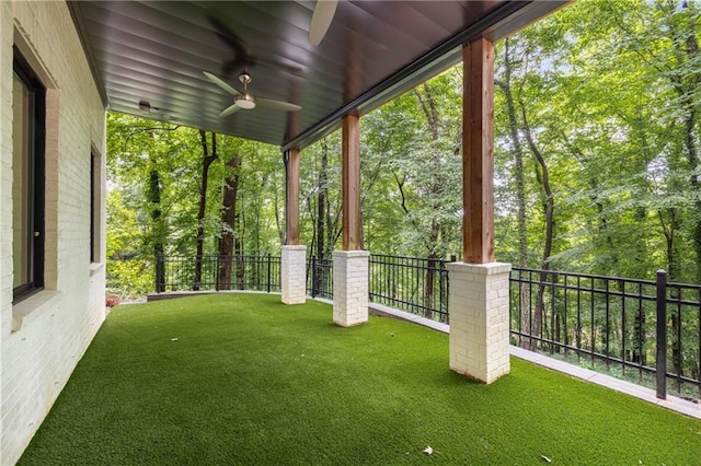 306 Pinecrest Rd NE, Atlanta, GA 30342 - view of yard featuring a balcony, ceiling fan, and view of wooded area