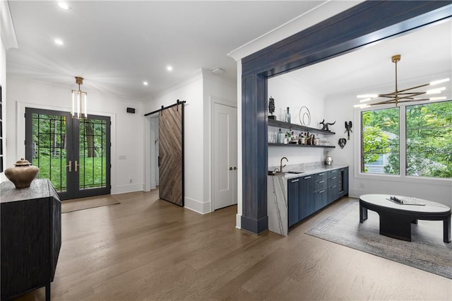 306 Pinecrest Rd NE, Atlanta, GA 30342 - indoor wet bar with plenty of natural light, wood finished floors, baseboards, recessed lighting, and crown molding
