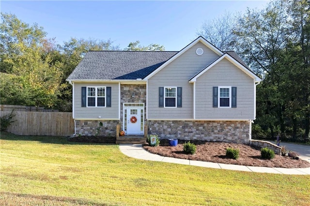 raised ranch with a front lawn