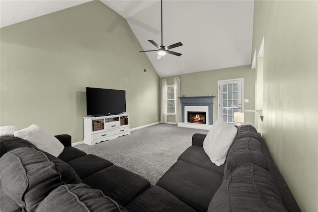 3625 Wapakonata Trl, Bethlehem, GA 30620 - living area featuring high vaulted ceiling, carpet flooring, ceiling fan, a warm lit fireplace, and baseboards