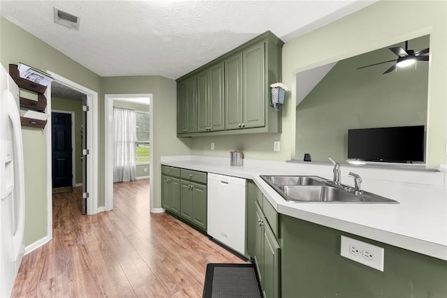 3625 Wapakonata Trl, Bethlehem, GA 30620 - kitchen featuring green cabinetry, white dishwasher, a sink, light countertops, and a textured ceiling