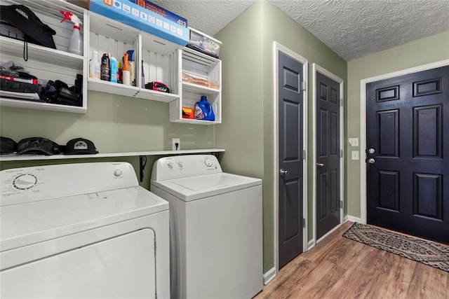 3625 Wapakonata Trl, Bethlehem, GA 30620 - laundry area with washing machine and clothes dryer, wood finished floors, a textured ceiling, and baseboards