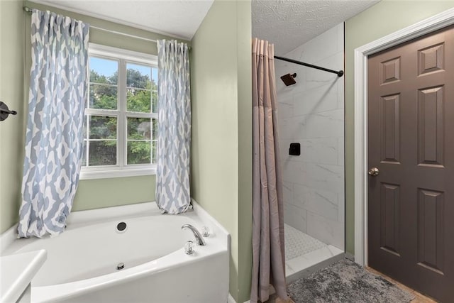 3625 Wapakonata Trl, Bethlehem, GA 30620 - full bathroom with a garden tub, a tile shower, and a textured ceiling