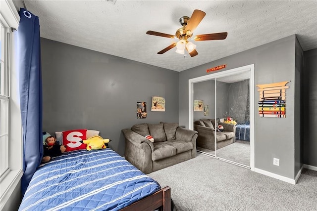 3625 Wapakonata Trl, Bethlehem, GA 30620 - bedroom with carpet flooring, baseboards, ceiling fan, a textured ceiling, and a closet