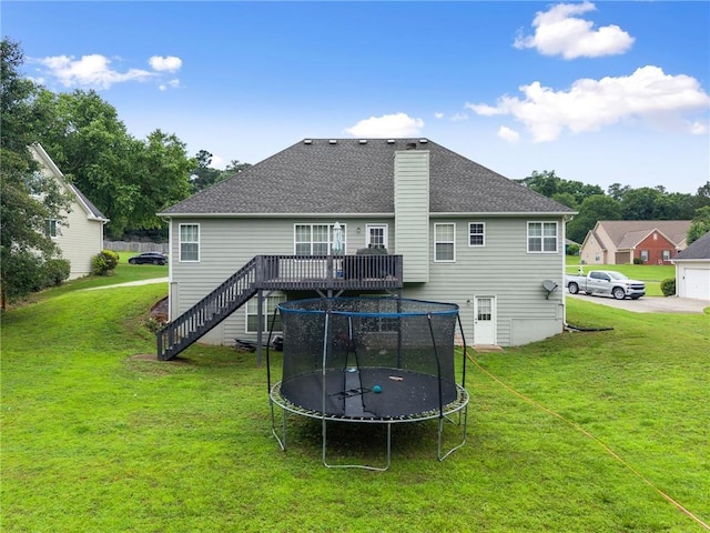 3625 Wapakonata Trl, Bethlehem, GA 30620 - rear view of property with a trampoline, stairs, a wooden deck, and a lawn