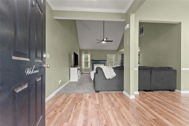 3625 Wapakonata Trl, Bethlehem, GA 30620 - living area with light wood-type flooring, baseboards, a ceiling fan, a fireplace, and ornamental molding