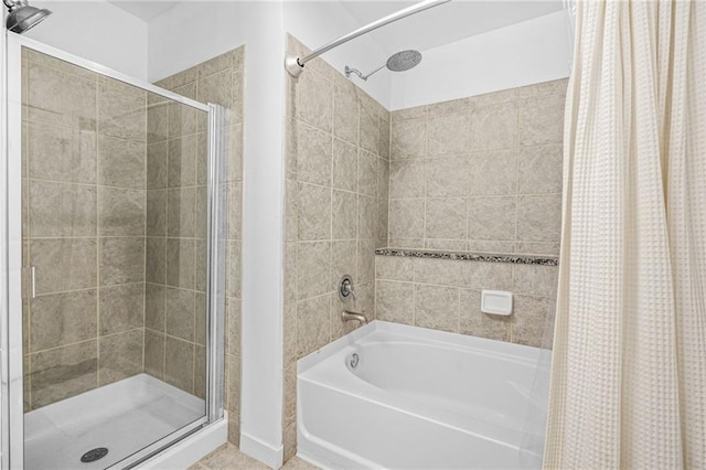 full bath with a bathtub and a shower stall