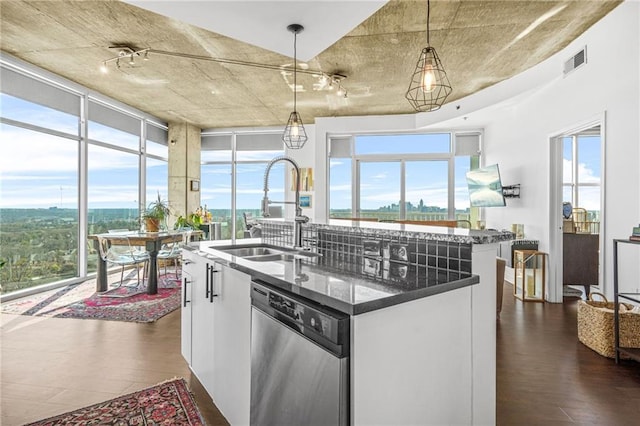 kitchen with visible vents, pendant lighting, a sink, dishwasher, and dark wood-style flooring