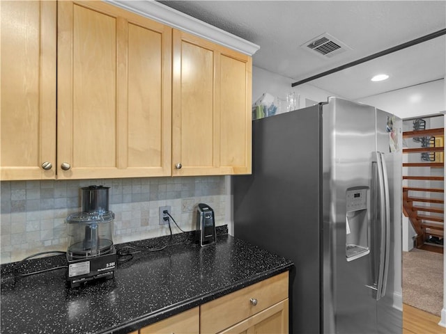 kitchen featuring visible vents, decorative backsplash, stainless steel fridge with ice dispenser, light brown cabinetry, and recessed lighting