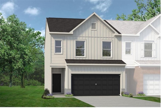 view of front of property featuring a garage and a front yard