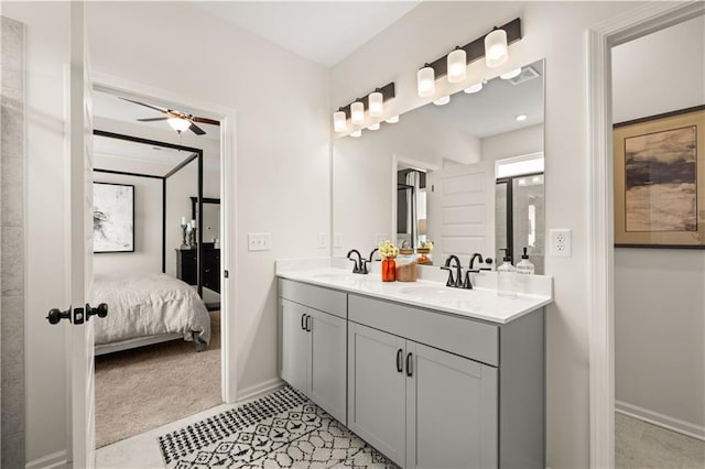 bathroom with ceiling fan and vanity