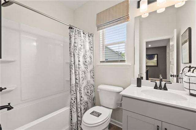 full bathroom featuring toilet, vanity, and shower / bath combination with curtain