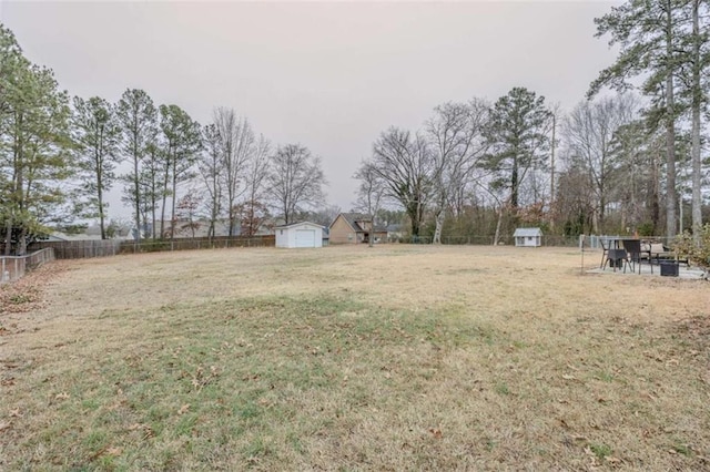 view of yard with a storage unit