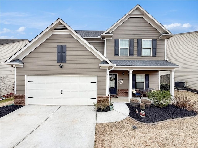 craftsman house with cooling unit and a porch