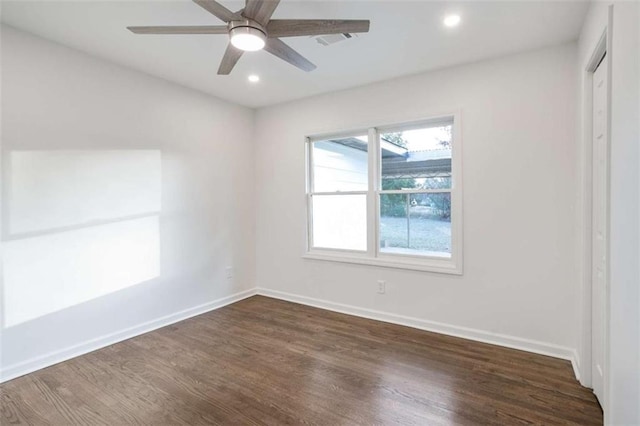 unfurnished room featuring ceiling fan and dark hardwood / wood-style floors