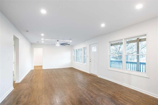 spare room featuring ceiling fan and dark hardwood / wood-style floors