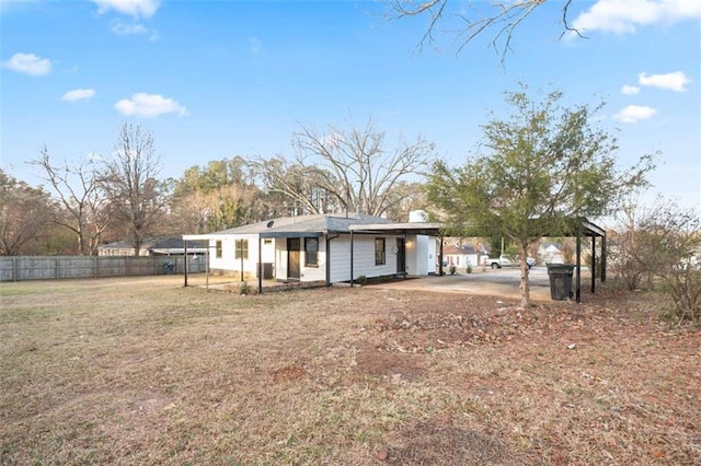 back of house featuring a yard