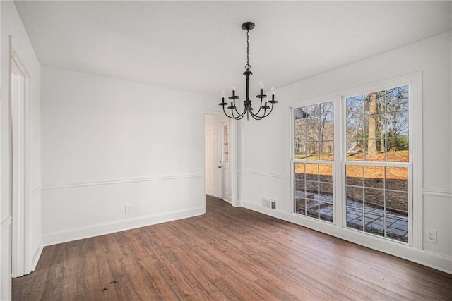 7935 Sweetwater Dr, Douglasville, GA 30135 - unfurnished dining area with a chandelier and wood finished floors