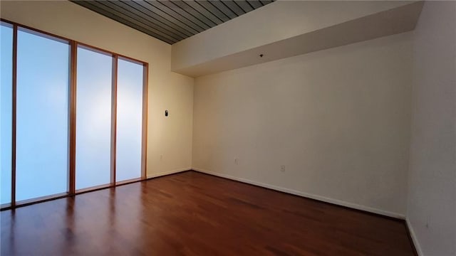620 Glen Iris Dr NE Unit 321, Atlanta, GA 30308 - empty room featuring dark wood finished floors and baseboards
