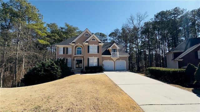 4569 Campenille Trce, Suwanee, GA 30024 - view of front of property featuring stucco siding, concrete driveway, and an attached garage