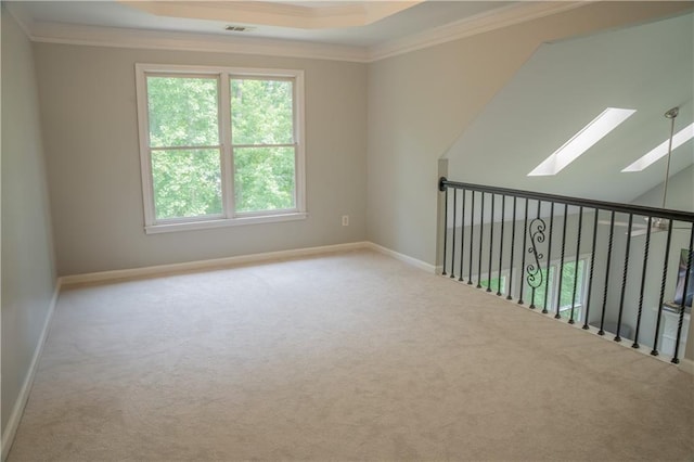 4569 Campenille Trce, Suwanee, GA 30024 - carpeted empty room featuring crown molding, a skylight, healthy amount of natural light, and a tray ceiling