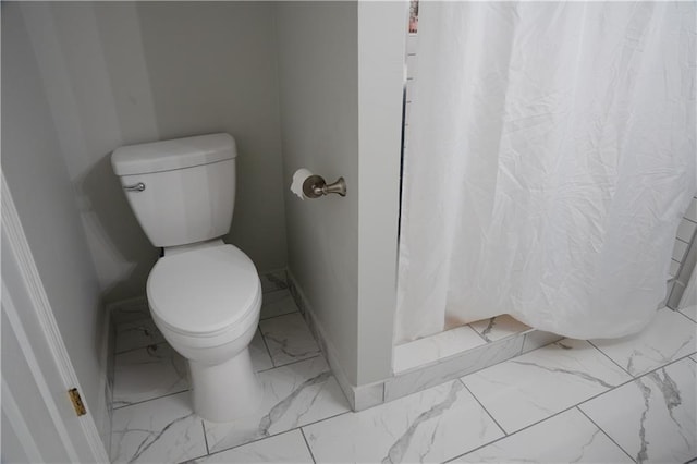 4569 Campenille Trce, Suwanee, GA 30024 - bathroom featuring marble look tile flooring and curtained shower