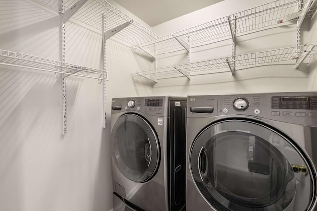 laundry area with washing machine and dryer