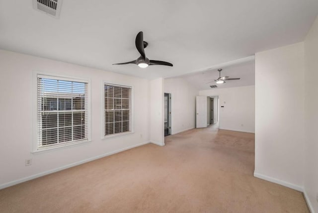 unfurnished room with light carpet, lofted ceiling, and ceiling fan