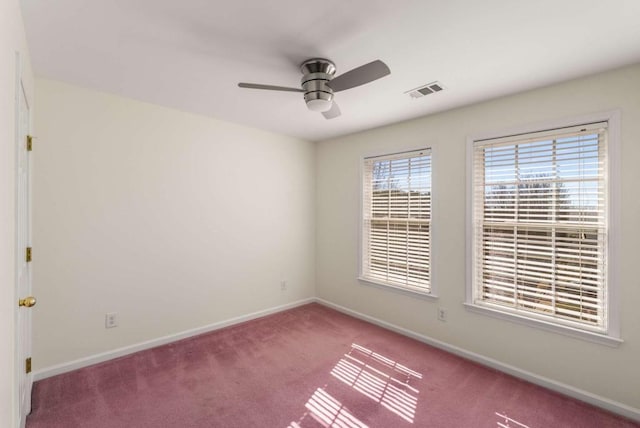 empty room with carpet flooring and ceiling fan