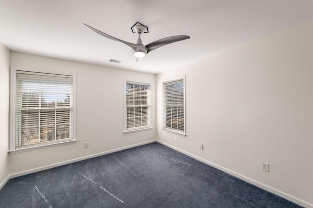 carpeted empty room with ceiling fan