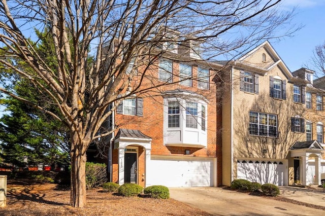 townhome / multi-family property featuring a garage