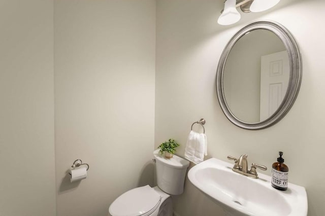 bathroom with sink and toilet