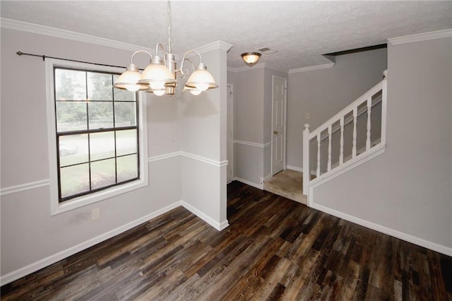 unfurnished dining area with a chandelier, wood finished floors, baseboards, stairs, and ornamental molding